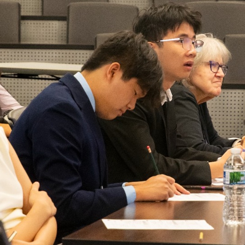 Judges reviewing notes at the Green Dream judging table