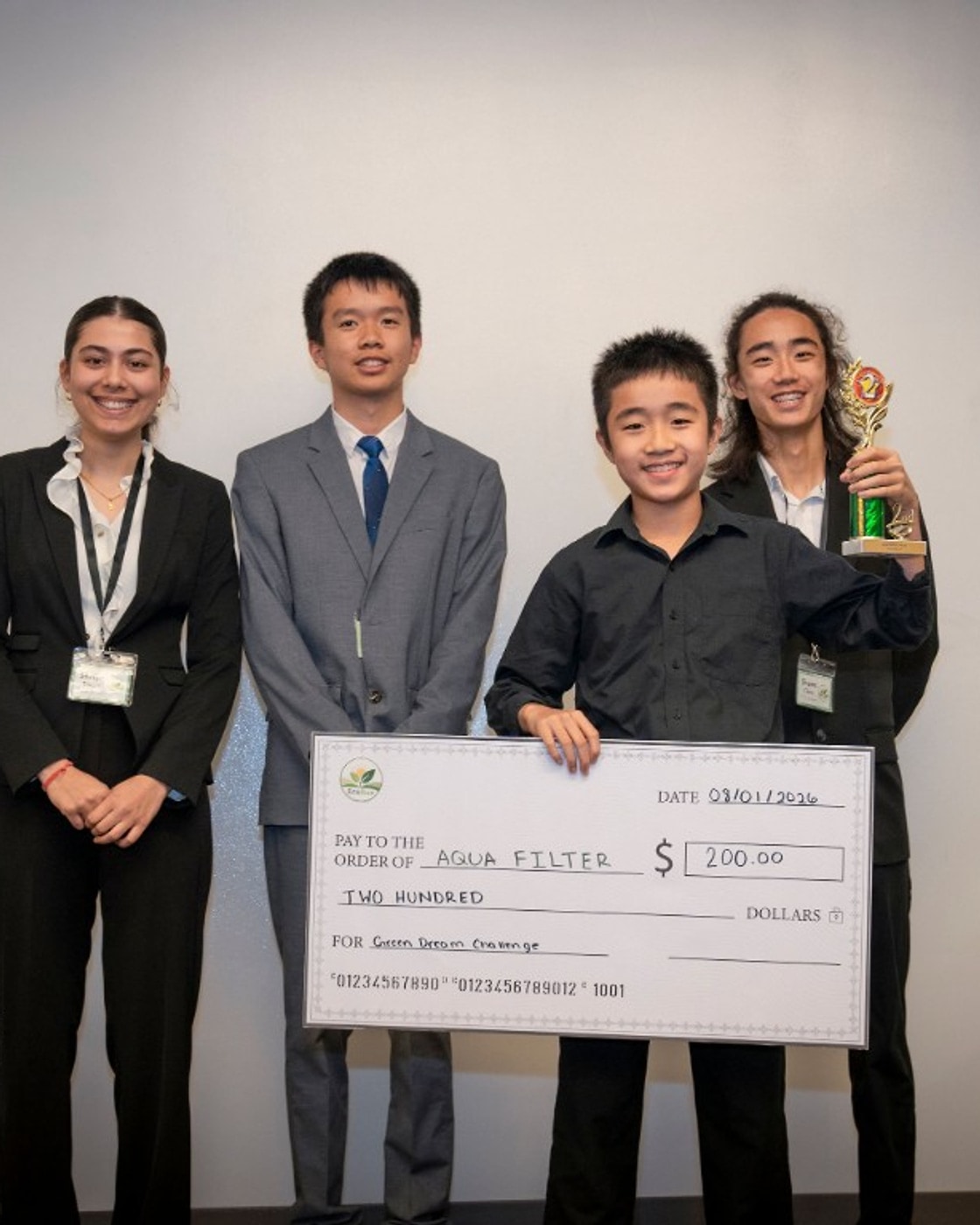 Ethan Chen with the AquaFilter second-place trophy and $200 prize check