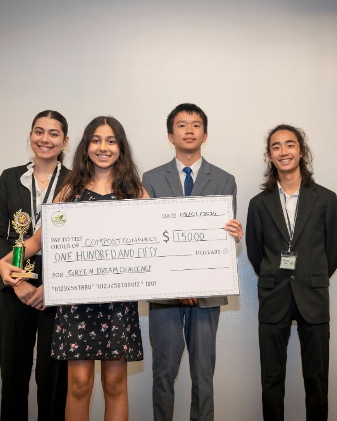 Anika Tiwari with the Compost Connect third-place trophy and $150 prize check