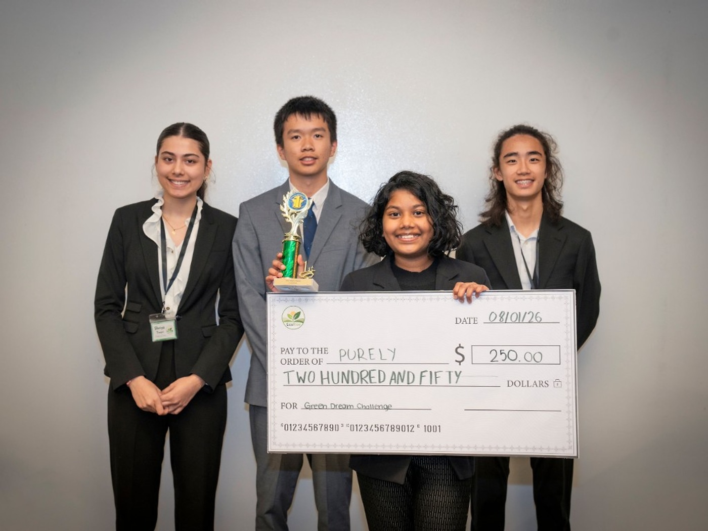 Shanvitha Palakurthi with the Purely first-place trophy and $250 prize check