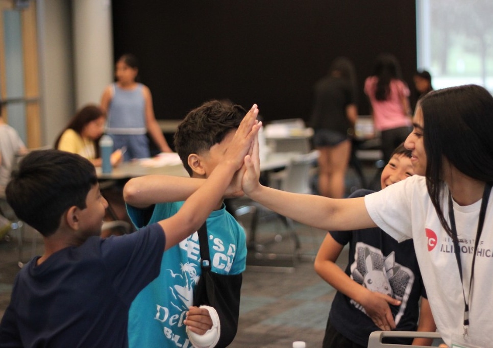 Student raising their hand during an EcoRise camp session