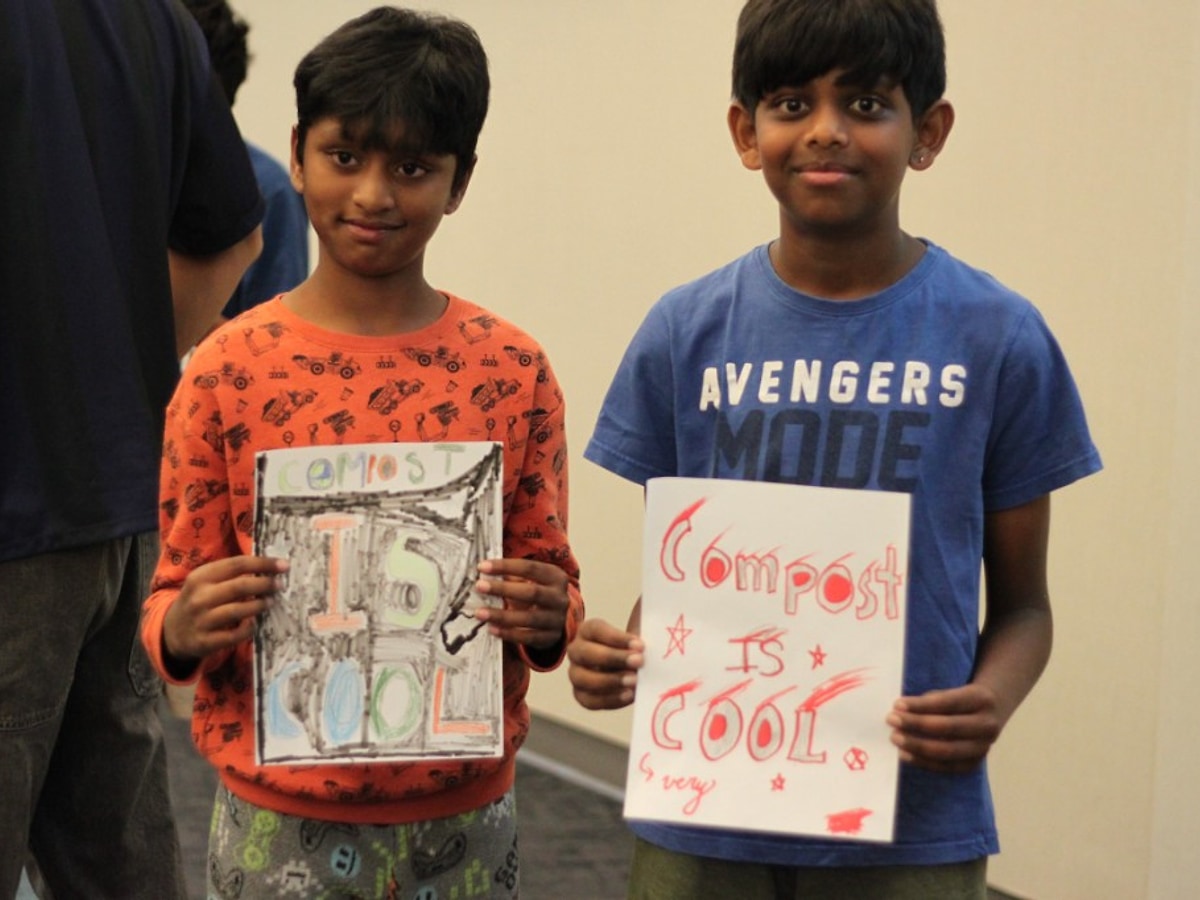 Students holding Compost Is Cool posters